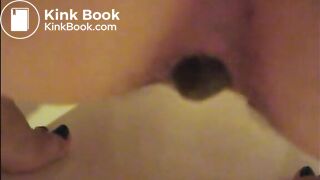 Mature woman shitting an hard turd closeup