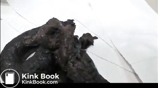 Very sexy brunette in high heels and lingerie shitting a black turd