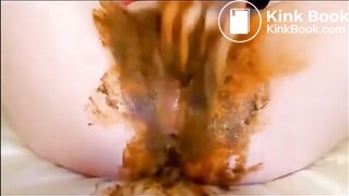 Girl masturbating pussy and ass while shitting