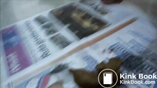 Naomi pooping on newspaper