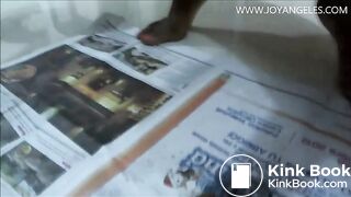 Naomi pooping on newspaper