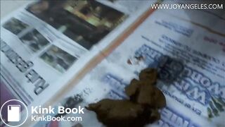 Naomi pooping on newspaper