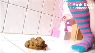 Long legs girl shitting on the bathroom floor