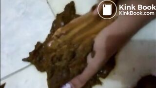 Brunette shitting and smears it on her feet and legs