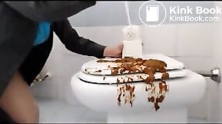 Brunette shitting on the cover of toilet then put her face on it