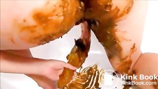 Girl shitting and masturbating with shitty dildo