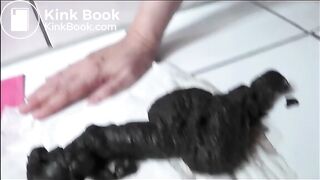 Pierced pussy woman shitting a big quantity of black shit