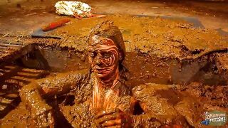 Betty has fun in the manure channel - bathing in cowshit