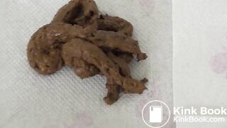 Attractive brunette poops on the floor