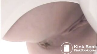 Girl shitting a lot in the toilet closeup