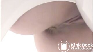 Girl shitting a lot in the toilet closeup