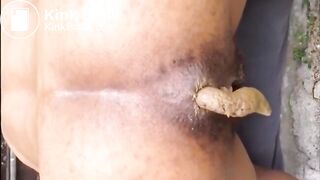 Hairy woman shitting doggystyle closeup