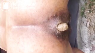 Hairy woman shitting doggystyle closeup