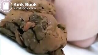 Blonde milf in high heels shitting on the floor