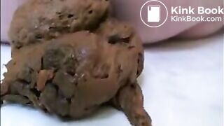 Blonde milf in high heels shitting on the floor