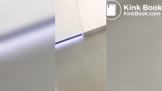 Big poop on the floor of a hospital toilet