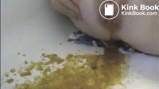 After enema woman shitting with power a lot in the bathtub