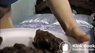 Blonde shitting turd on a plate and pissing on a glass