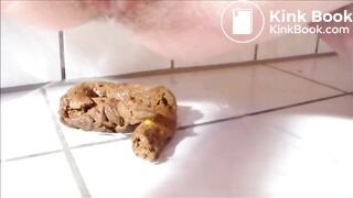Woman shitting on the bathroom floor