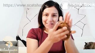 She catches her big poop and plays with it