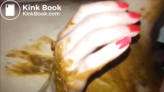 Woman masturbating with dildo and smearing shit