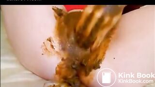 Babe masturbating with dildo while shitting
