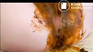 Babe masturbating with dildo while shitting