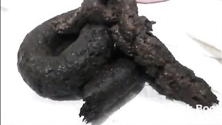 Sexy milf in lingerie and high heels shitting on the bathroom floor