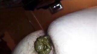 Hairy butt woman shitting a big quantity closeup