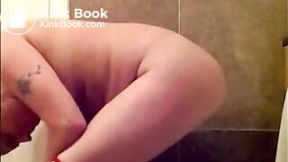 Woman shitting long turd on toilet standing