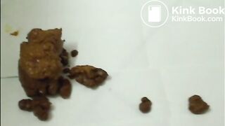 Brunette with glasses shitting and taste it