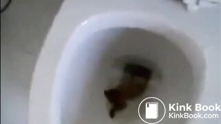 Girl shitting diarrhea in the toilet