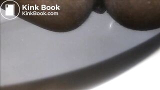 Ebony milf shitting closeup in the toilet