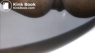 Ebony milf shitting closeup in the toilet