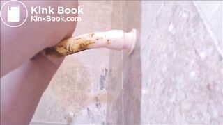 Dirty girl playing with shitty dildo in the bathroom