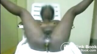 Ebony milf open wide legs and shitting on a chair