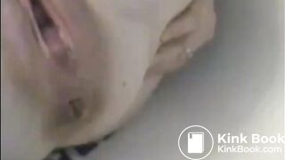 Woman shitting liquid after enema