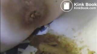 Woman shitting liquid after enema