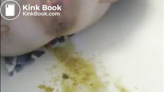 Woman shitting liquid after enema