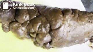 Blonde masturbates while pushing out a huge turd