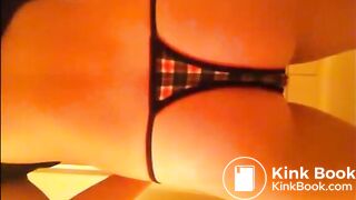 Brunette with tanga shitting on the floor