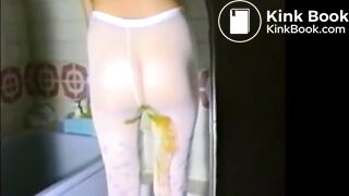Woman shitting liquid poo on white pantyhose