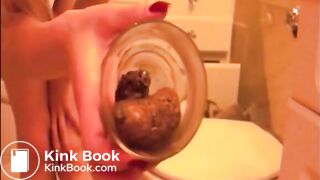 Skinny blonde girl shitting in a glass