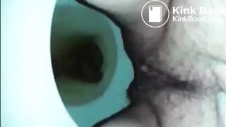 Hairy woman shit and piss in the toilet closeup