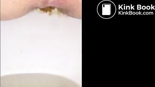Girl shitting long turd closeup