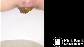 Girl shitting long turd closeup