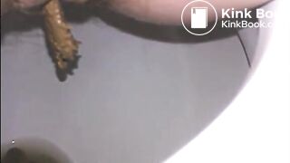 Woman shitting a long turd very slowly in the toilet