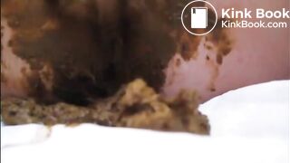 Mature lady masturbating with brush and shitting