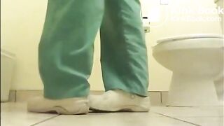 Girl shitting on the floor of the toilet