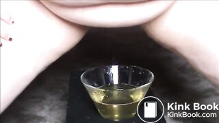 Fat hairy woman piss on a glass and shit on a platea_plate